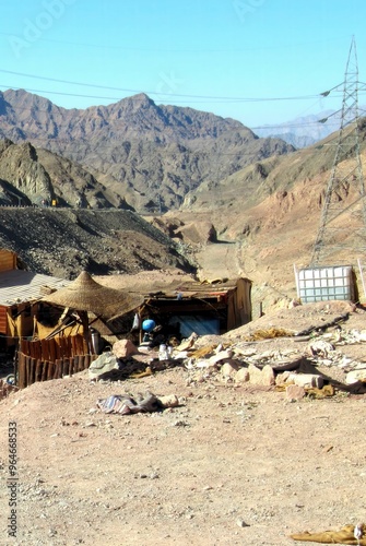 Roadside Stop in Sinai, Egypt, Featuring Wooden Buildings Against a Mountainous Backdrop