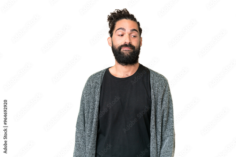 Young man with beard over isolated chroma key background making doubts gesture looking side Young man with beard over isolated chroma key background making doubts gesture looking side