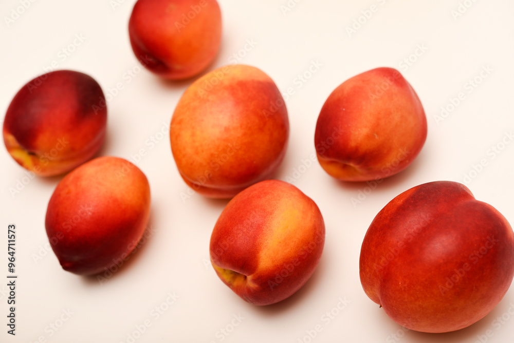 Juicy peaches on a white background. Ripe nectarines. Juicy peaches on a white background. Ripe nectarines.