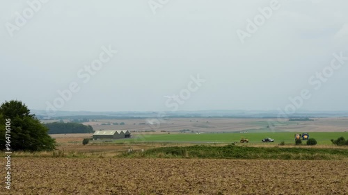 Twin Aster II ZE609 XJ, a low wing two-seat glider flying in a clear grey sky landing on a grass airfield photo