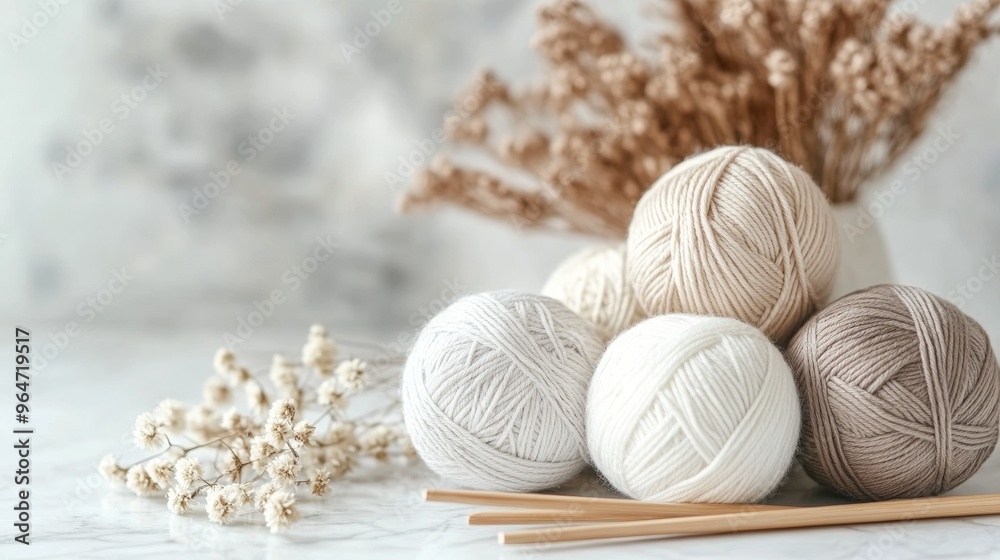 Neutral Yarn Balls with Knitting Needles and Dried Flowers in Boho Style Neutral Yarn Balls with Knitting Needles and Dried Flowers in Boho Style