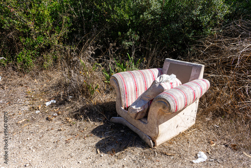 Photography Man's disregard for nature: a sofa abandoned in the middle of a field, showcasing a lack of environmental consciousness