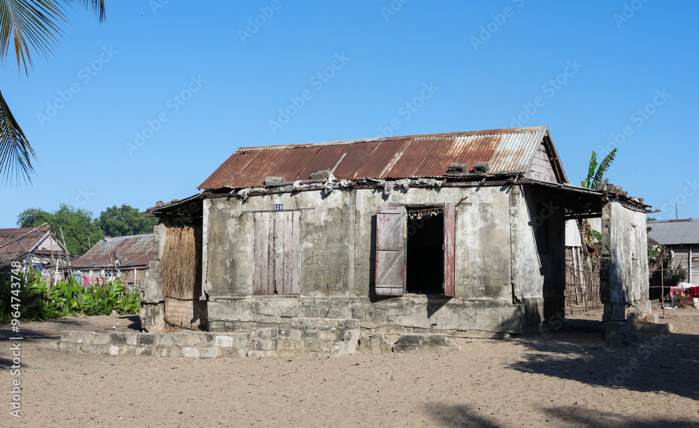 Authentic dwellings showcasing traditional architecture in Madagascar's rural areas under a clear blue sky Authentic dwellings showcasing traditional architecture in Madagascar's rural areas under a clear blue sky