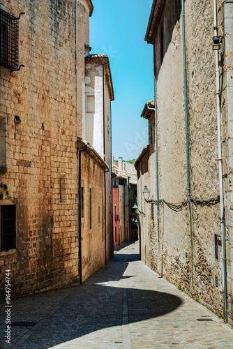 Fototapeta Naklejka Na Ścianę i Meble -  A quiet alleyway with old brick buildings