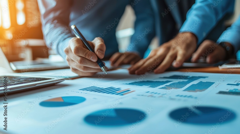 A close-up of a business team working together to discuss work. Analyzing with financial data and graphs of marketing growth reports in the team. A close-up of a business team working together to discuss work. Analyzing with financial data and graphs of marketing growth reports in the team.