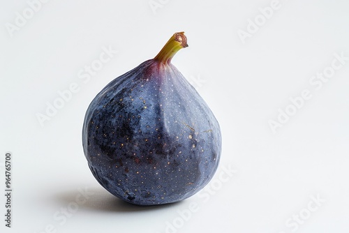 A fig sitting on a clean white surface