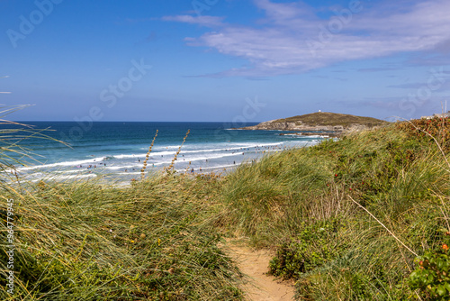 A view over Fistral Bay in Newquay, Cornwall, on a sunny summer's day photo