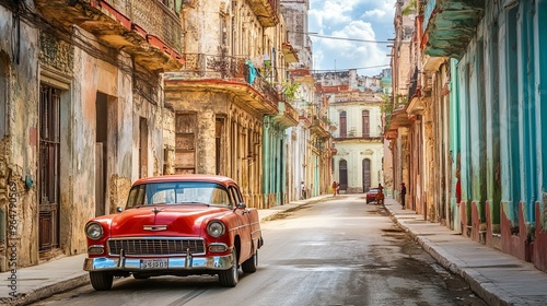 Classic red retro car driving through the historic streets of old Havana, Cuba’s timeless capital