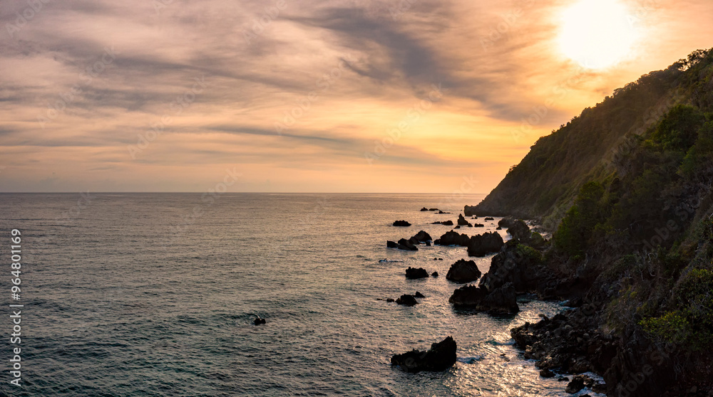 Panoramic view of beautiful and colorful sunrise at the Caribbean beach