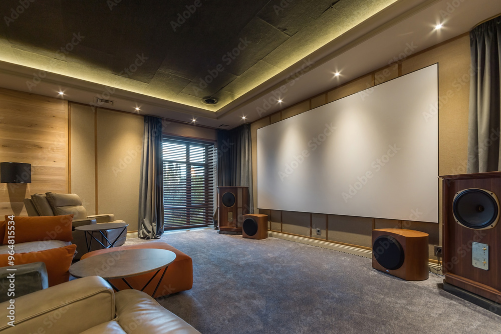 Fototapeta premium Modern interior of a home theater. Comfortable leather chairs, a large screen with speakers on both sides. Window with blackout curtains.
