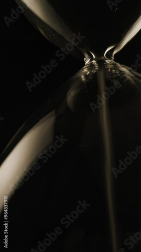 project video of the concept of countdown illustrated by an hourglass with sand passing through the bulbs