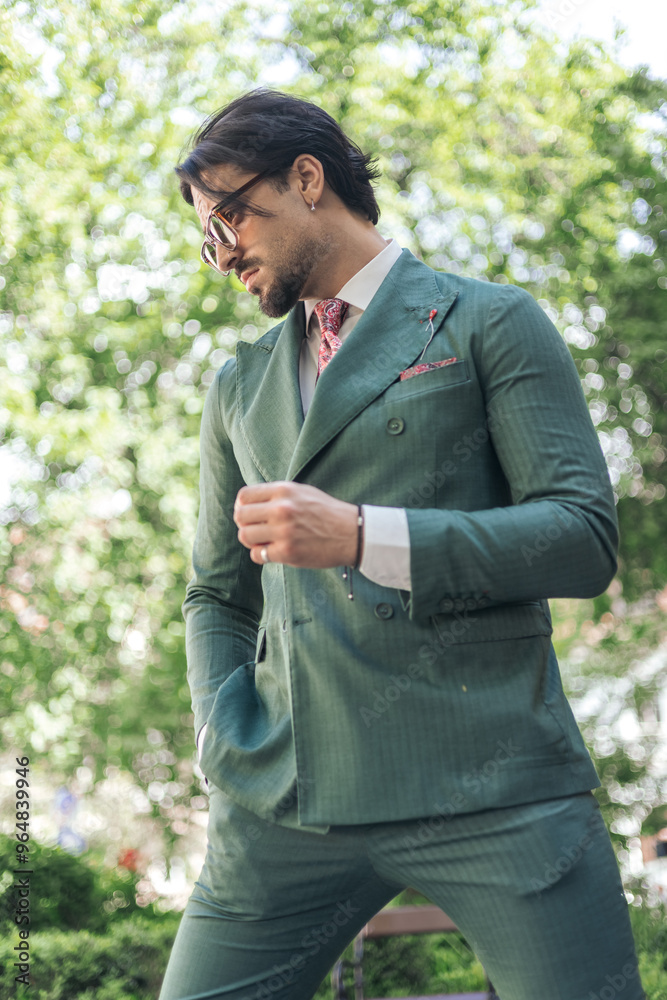 sexy elegant man with sunglasses holding hand in pocket sexy elegant man with sunglasses holding hand in pocket