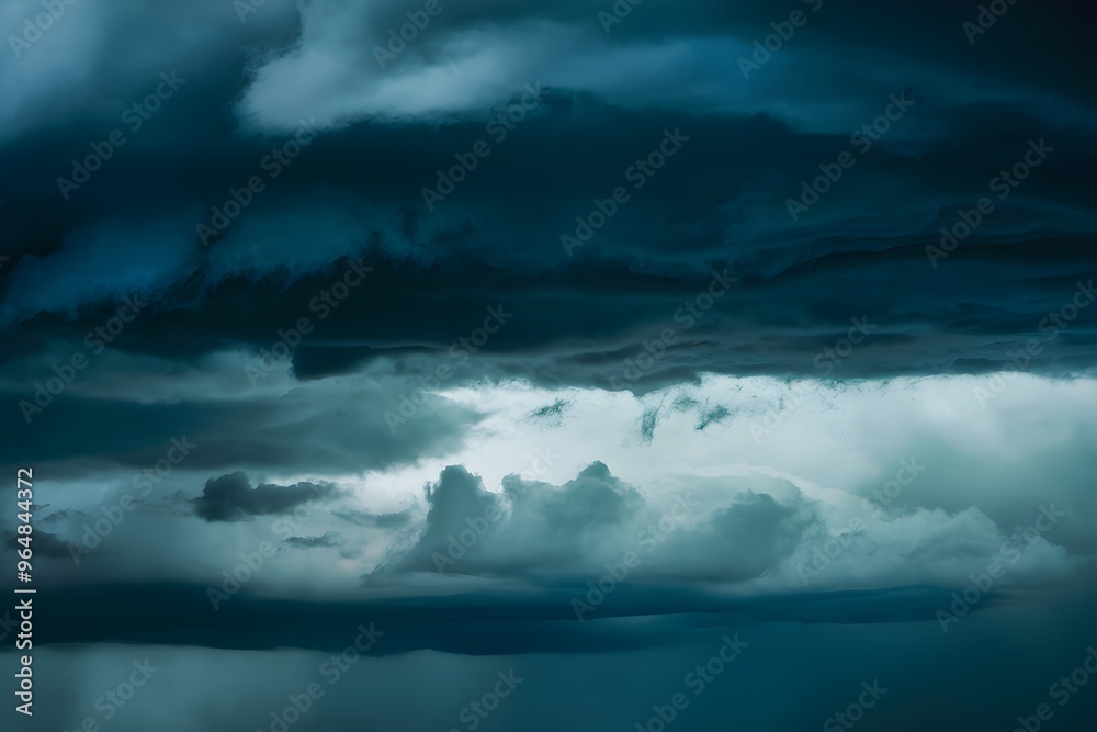 Stormy sky, dense clouds in dark blues and grays, intense atmosphere approaching Stormy sky, dense clouds in dark blues and grays, intense atmosphere approaching