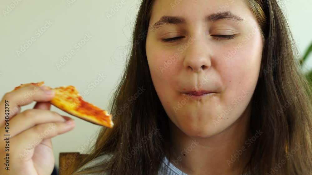 Teenage girl eats homemade pizza Teenage girl eats homemade pizza