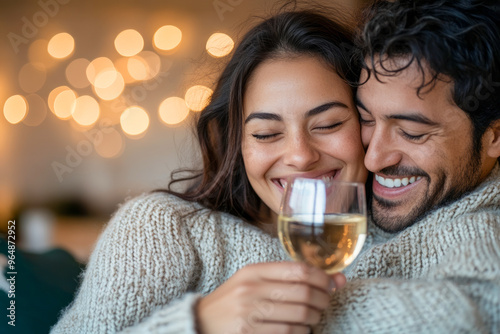 Happy Couple Enjoying Wine and Cuddling Together