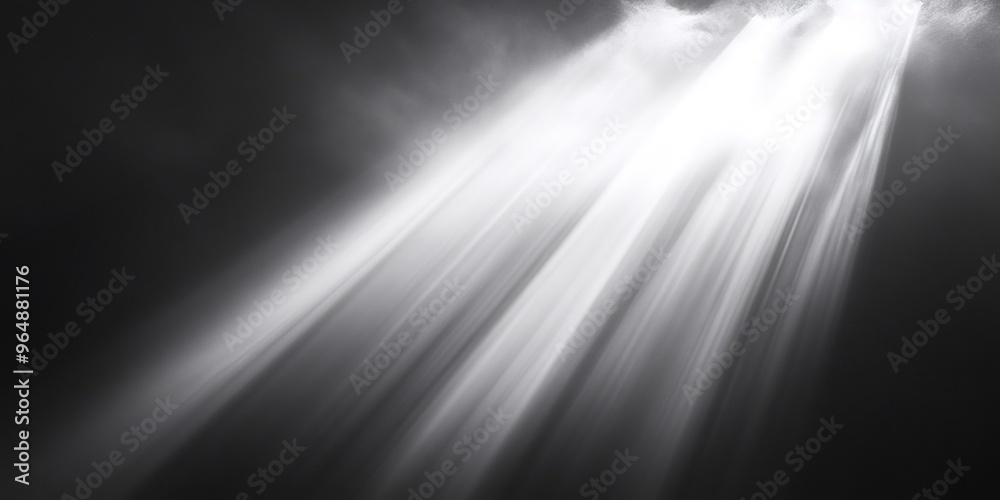 A close-up shot of a bright light shining through the clouds, casting a beam of light onto a dark background. A close-up shot of a bright light shining through the clouds, casting a beam of light onto a dark background.