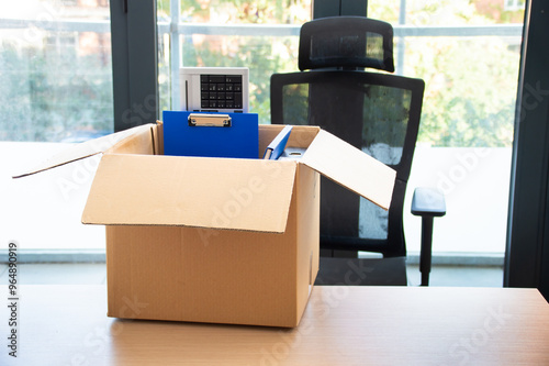 Moving office and packing belongings in a box or getting fired