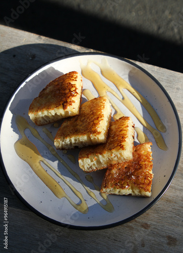 Honey crumpets on plate