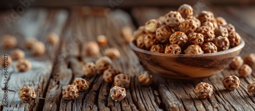 Dried Tiger Nuts Over Wooden Background photo