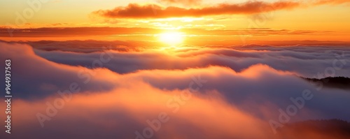 Sunrise above fluffy clouds with vibrant colors, scenic vista. Atmospheric beauty and tranquility concept