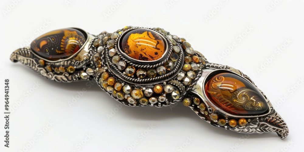 Obraz premium Antique brooch pin adorned with silver-tone beads and authentic amber, suitable for costume jewelry.