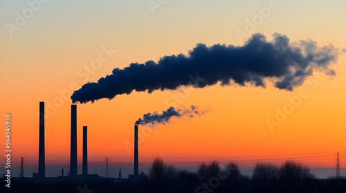 A stunning sunset backdrop highlights industrial smokestacks releasing dark smoke, symbolizing pollution and environmental impact.