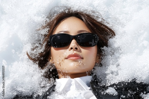 Stylish woman in sunglasses during winter photo