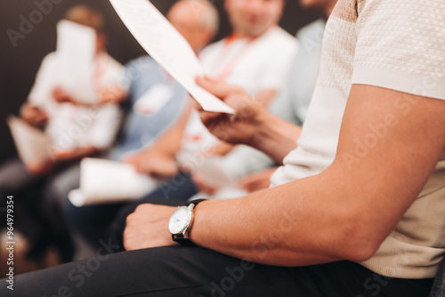 фотографія Choir rehearsal, vocal class singing in the auditorium hall, group of students o