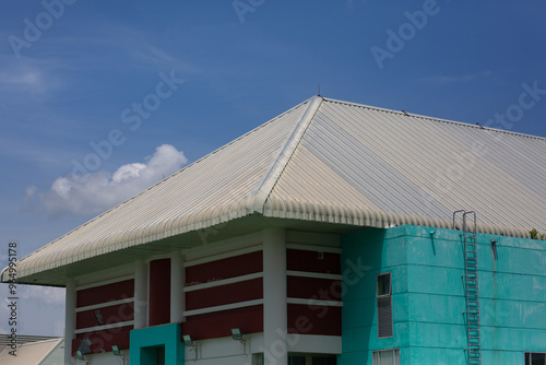 Large buildings with metal roofs instead of tiles