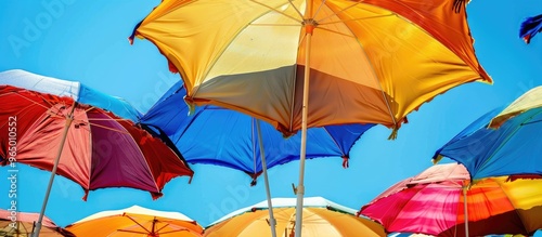 Detail Of Colorful Sunshades In The Beach On A Sunny Summer Day photo