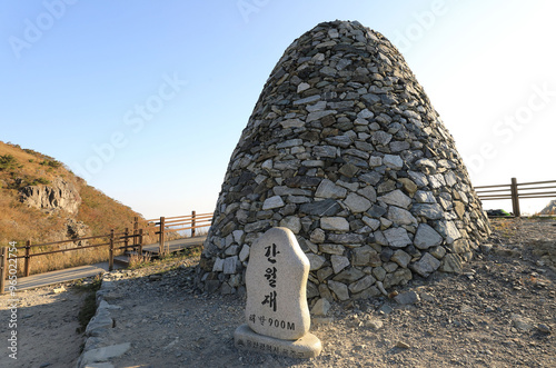 Yeongnam Alps, Ulju-gun, Ulsan, South Korea - October 17, 2020: Stone tower and Summit Stone of Ganwoljae Pass at Ganwol Mt photo