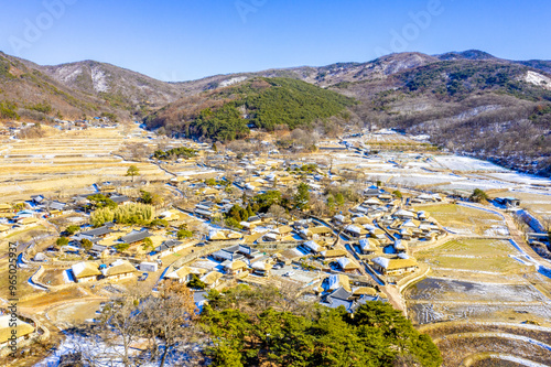 Oeam-ri, Asan-si, Chungcheongnam-do, South Korea - February 4, 2021: Aerial view of snow covered Oeam Folk Village photo