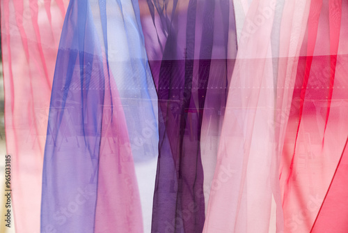 Colorful transparent Korean traditional clothes are being dried on a clothesline at Namsan Hanok Village near Seoul, South Korea  photo