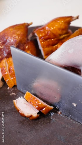 chef chopping roast duck