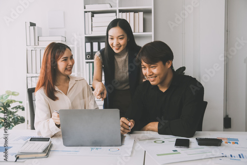 Financial analysts analyze business financial reports on a digital tablet planning investment project during a discussion at a meeting of corporate showing the results of their successful teamwork.