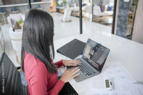 Beautiful confident asian business woman working with laptop Hands typing keyboard. Professional investor working new start up project. business planning in office. Technology business.