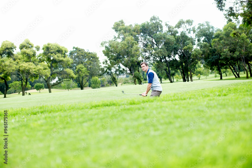 Grass, game and man on golf course for outdoor exercise, fitness and challenge in morning with trees. Sports, play and professional golfer on green for competition, health and wellness in nature Grass, game and man on golf course for outdoor exercise, fitness and challenge in morning with trees. Sports, play and professional golfer on green for competition, health and wellness in nature