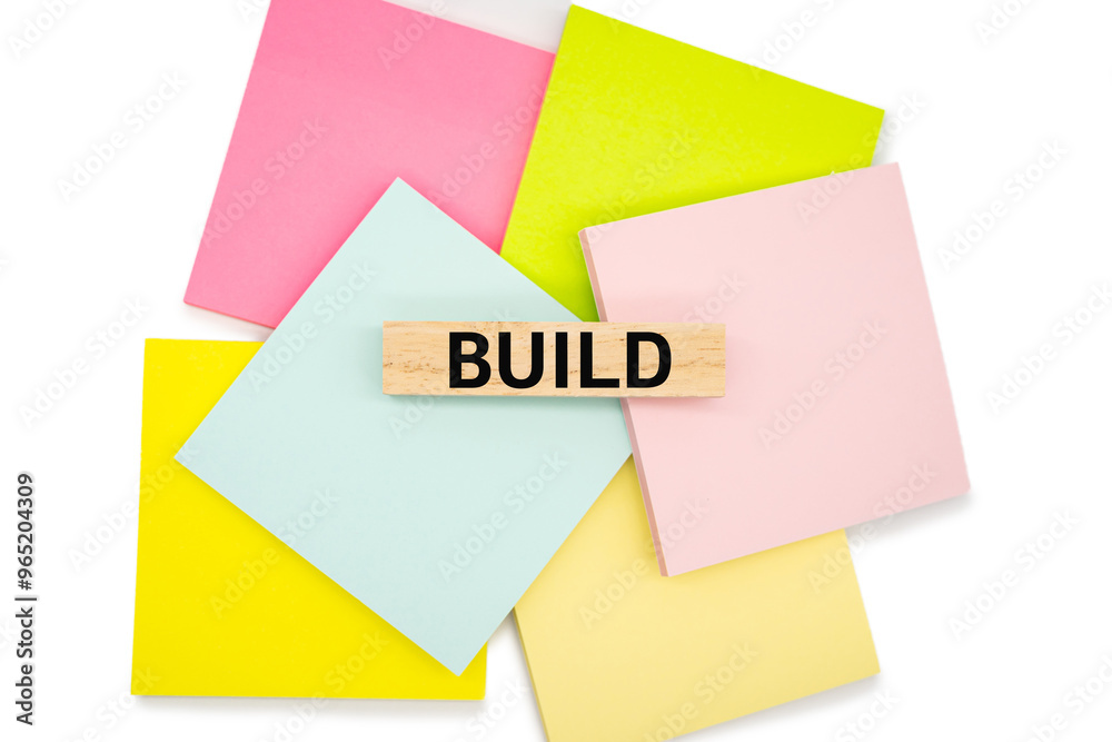 BUILD text wooden block on colorful sticky note. Build your Brand. Brand building, success, business. BUILD text wooden block on colorful sticky note. Build your Brand. Brand building, success, business.