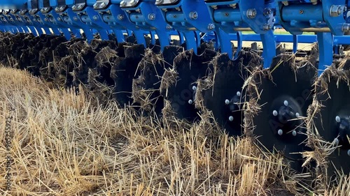 Close-up of a large modern plow disc harrow for cultivating the land. photo