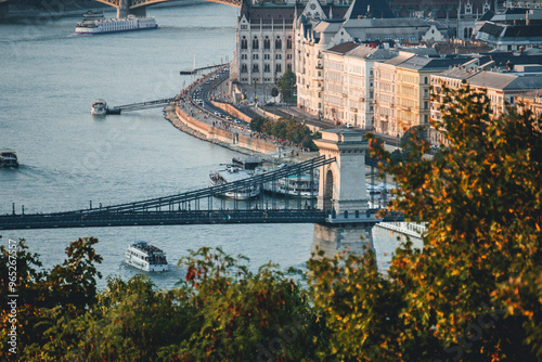 deatil side view of one of the towers of famous chain bridge with clear danube waters in budapest capital city on clear morning sky day photo