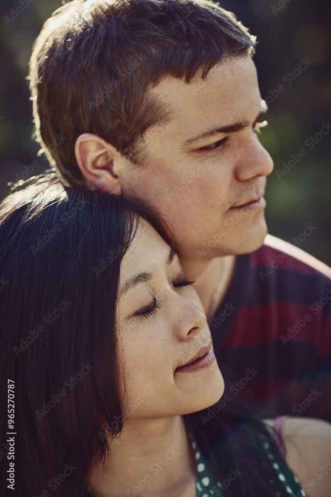 Happy, love and couple hug in park for bonding, loving relationship and relax together outdoors. Dating, interracial and face of man and woman embrace for affection, commitment and romance in nature Happy, love and couple hug in park for bonding, loving relationship and relax together outdoors. Dating, interracial and face of man and woman embrace for affection, commitment and romance in nature