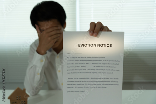 document with the text eviction notice, Civil servant sticks a notice of eviction of the tenants hangs on the door of the house, debt, property, loan, agent, bankruptcy, dispossess, problem photo