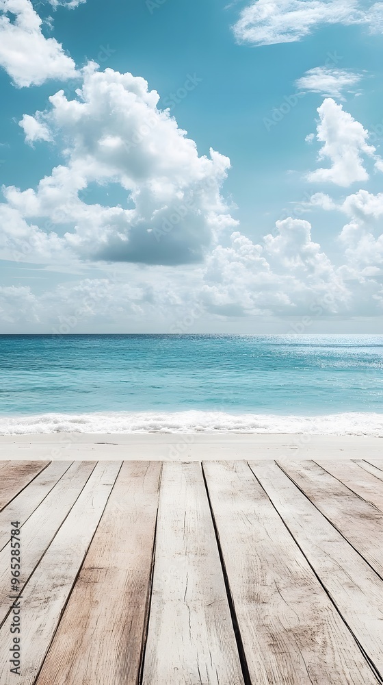 Wooden Deck Overlooking a Beach with Blue Sky and White Clouds Wooden Deck Overlooking a Beach with Blue Sky and White Clouds