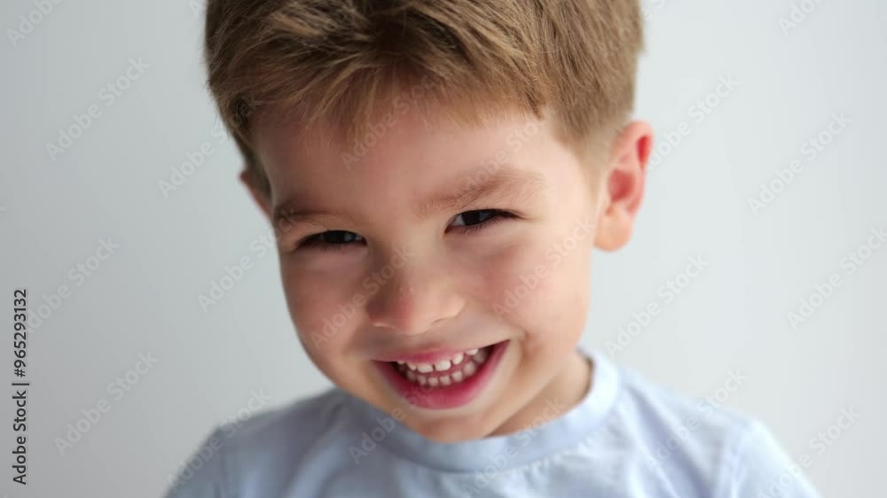portrait of cute laughing little boy on grey background portrait of cute laughing little boy on grey background