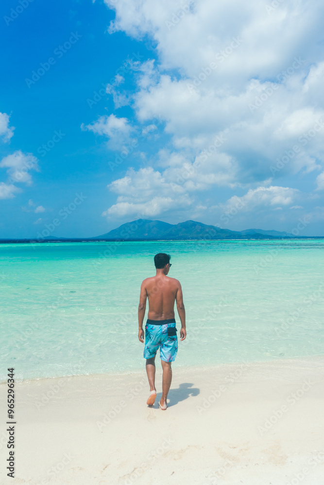 Happy traveller man in tropical beach on enjoys her summer vacation Happy traveller man in tropical beach on enjoys her summer vacation