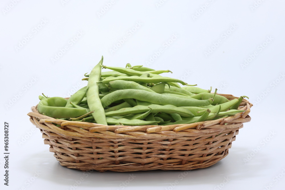 green beans in wicker basket isolated on white background green beans in wicker basket isolated on white background