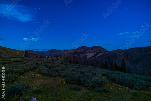 mountain valley at twilight with clear night sky