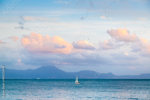 Obraz na płótnie Yacht sailing in Gulf of Naples, Italy. View of the mountains and the sky at sunset. w salonie