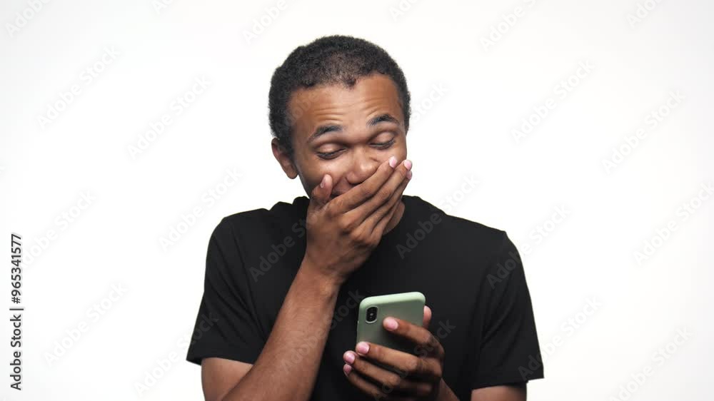 Excited man celebrating success while holding smartphone Excited man celebrating success while holding smartphone