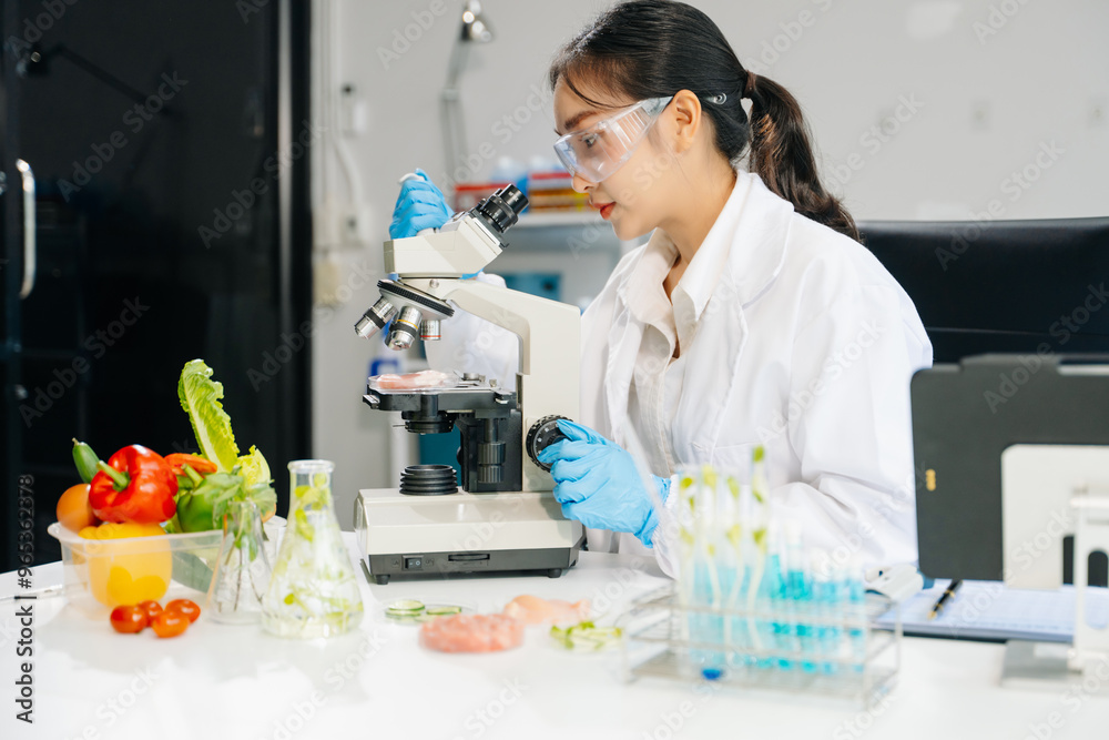 Food scientists in lab coats, testing samples, and analyzing food safety and quality in a laboratory Food scientists in lab coats, testing samples, and analyzing food safety and quality in a laboratory